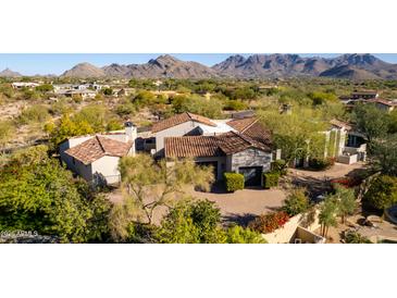 Luxury home with tile roof, large backyard and pool, mountain views at 19198 N 95Th Pl, Scottsdale, AZ 85255