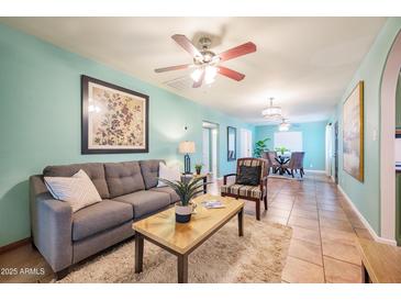 Bright living room featuring hardwood floors and a cozy sitting area at 2021 W Osborn Rd, Phoenix, AZ 85015