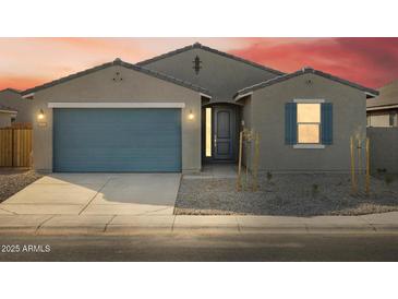 Single-story home with a two-car garage and landscaping at 2645 E Santa Ynez Dr, Casa Grande, AZ 85194