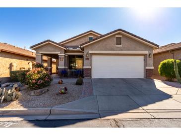 One-story house with desert landscaping and a two-car garage at 31627 N Poncho Ln, San Tan Valley, AZ 85143