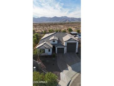 New construction home with mountain views and two-car garage at 8300 N 186Th Ln, Waddell, AZ 85355