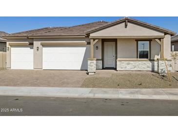 Charming single-story home with a two-car garage and desert landscaping at 17666 W Pierson St, Goodyear, AZ 85395