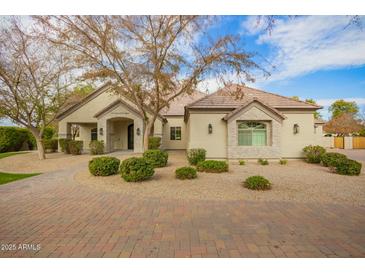 Beautiful two-story home with a tile roof and landscaped yard at 2090 E Coconino Ct, Gilbert, AZ 85298