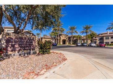 Mountain Canyon Condo community entrance with signage and ample parking at 3236 E Chandler Blvd # 2033, Phoenix, AZ 85048