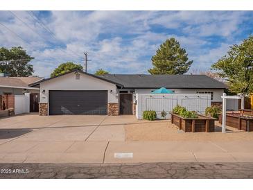 Cute curb appeal! Newly renovated home with landscaped front yard and 2-car garage at 6262 N 85Th St, Scottsdale, AZ 85250