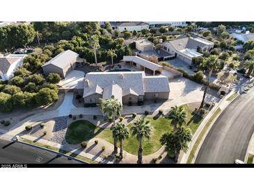 Luxury home with pool, large yard, and detached garage, seen from above at 3835 E Leland St, Mesa, AZ 85215