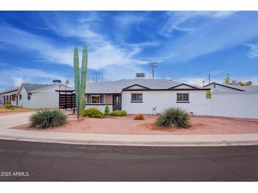 Charming single story home with modern updates and desert landscaping at 1721 S Shafer Dr, Tempe, AZ 85281