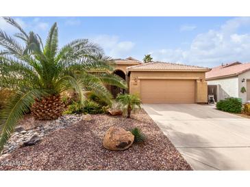 Single-story home with desert landscaping and two-car garage at 30636 N Royal Oak Way, San Tan Valley, AZ 85143