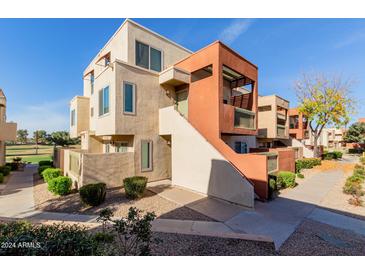 Contemporary condo building with attractive landscaping and walkway at 3500 N Hayden Rd # 1902, Scottsdale, AZ 85251