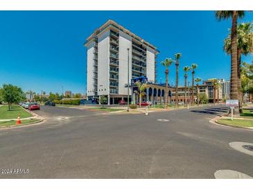 Highrise building exterior with palm trees and city view at 805 N 4Th Ave # 609, Phoenix, AZ 85003