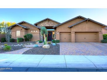 Stunning desert home with attractive landscaping and three-car garage at 6217 E Sienna Bouquet Pl, Cave Creek, AZ 85331