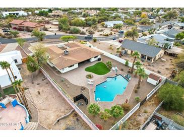 Aerial view of a house with a pool and spacious backyard at 1750 E Euclid Ave, Phoenix, AZ 85042