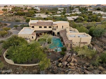 Large estate home with a pool and landscaped grounds in a secluded area at 15419 E Stardust Dr, Fountain Hills, AZ 85268