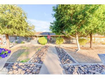 Cute ranch home with landscaped walkway and mature trees at 2727 N 20Th Dr, Phoenix, AZ 85009
