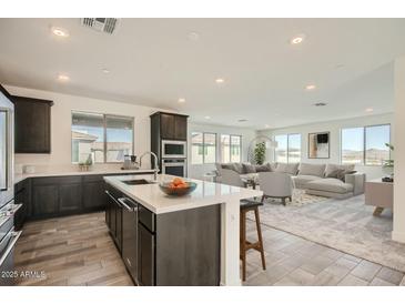 Modern kitchen with an island, stainless steel appliances, and an open concept layout perfect for entertaining and daily living at 2121 W Sonoran Desert Dr # 29, Phoenix, AZ 85085