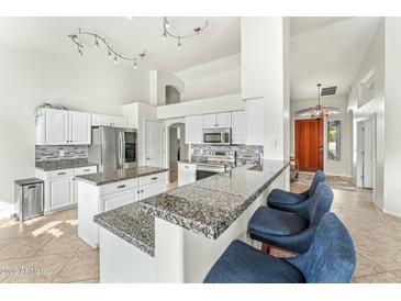 Spacious kitchen with granite countertops and island at 6713 E Paradise Ln, Scottsdale, AZ 85254