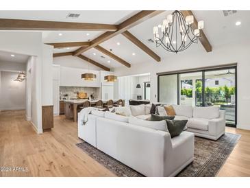 Open concept living and kitchen area with exposed beams at 4424 N 38Th St, Phoenix, AZ 85018