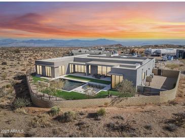 Luxury home with pool and desert landscape; expansive mountain views at 12808 E Harper Dr, Scottsdale, AZ 85255