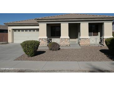 Single-story home with attached two-car garage and landscaped front yard at 8808 W State Ave, Glendale, AZ 85305