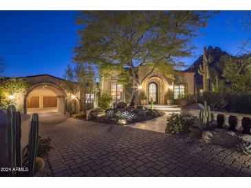 Elegant home with stone accents and landscaped grounds at 26872 N 102Nd St, Scottsdale, AZ 85262