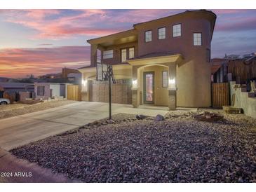 Two-story house with a large driveway and basketball hoop at 13032 N 19Th St, Phoenix, AZ 85022