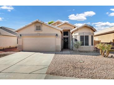 Single-story house with a two-car garage and desert landscaping at 2524 N Sunaire --, Mesa, AZ 85215