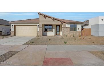 Charming single-story home with desert landscaping and neutral color palette at 14778 W Tether Trl, Surprise, AZ 85387