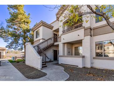 Attractive exterior of a two-story condo building with stairs leading to entrance at 1941 S Pierpont Dr # 2098, Mesa, AZ 85206