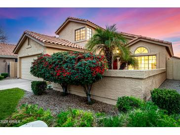 Two-story house with tan stucco, red tile roof, and landscaped front yard at 41 E Caroline Ln, Tempe, AZ 85284