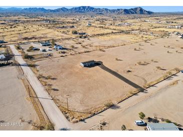 Aerial view of a single-wide manufactured home on a large lot with desert landscape at 53275 W Adele Rd, Maricopa, AZ 85139