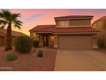 Inviting two-story home with a terracotta tile roof and desert landscaping at 5951 E Trailridge St, Mesa, AZ 85215