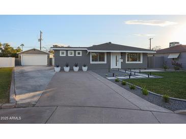 Newly renovated home with modern gray exterior and landscaping at 2329 E Turney Ave, Phoenix, AZ 85016