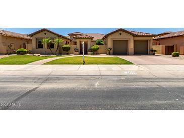 Charming single-Gathering home featuring a well-maintained front yard and inviting curb appeal at 14539 W Sheridan St, Goodyear, AZ 85395