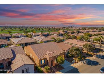 Aerial view of a luxury home community with mountain views and golf course at 1351 E Artemis Trl, Queen Creek, AZ 85140