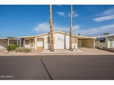 Single-story home with a light-colored exterior and landscaping at 8103 E Southern Ave # 287, Mesa, AZ 85208