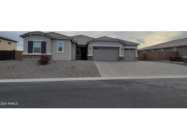 Single-story home with two-car garage and landscaped front yard at 12519 W Krall Ct, Glendale, AZ 85307