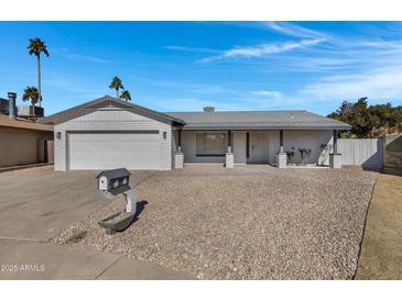 Updated single-story home with a two-car garage and rock landscaping at 4708 W Cheryl Dr, Glendale, AZ 85302