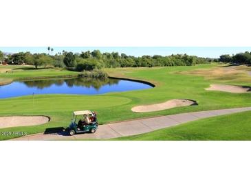 Golf course view with a golf cart at 5122 E Shea Blvd # 1117, Scottsdale, AZ 85254