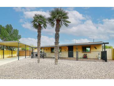 Ranch style home with carport and fenced yard at 2955 E Piute Ave, Phoenix, AZ 85050