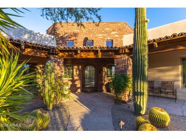 Spanish style home with courtyard entry and fountain at 35931 N 82Nd Pl, Scottsdale, AZ 85266