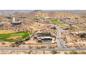 Expansive aerial view of a luxury home bordering a golf course in a desert community at 3703 S Avenida De Angeles --, Gold Canyon, AZ 85118