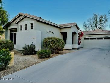 Single-story home with attached two-car garage and landscaped front yard at 5185 S Eileen Dr, Chandler, AZ 85248
