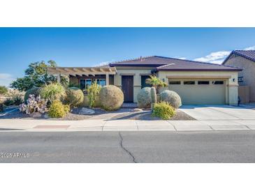 Single-story home with desert landscaping and a two-car garage at 17103 S 182Nd Ln, Goodyear, AZ 85338