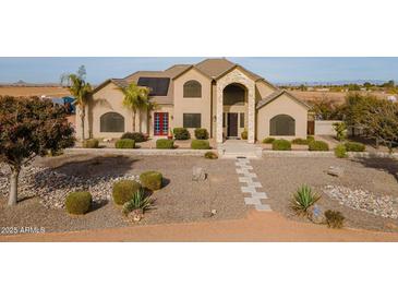 Two story home with solar panels and landscaped yard at 3770 E Graythorn Way, Coolidge, AZ 85128