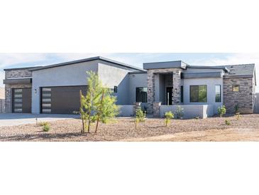 Stunning modern home with two-car garage and attractive landscaping at 103 E Quartz Rock Rd, Phoenix, AZ 85085