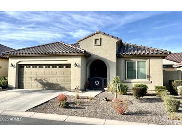 Single-story home with a two-car garage and desert landscaping at 20416 W Calle Encorvada Ln, Buckeye, AZ 85396