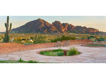 Spacious patio with mountain views and a circular garden feature at 7150 N Hillside Dr, Paradise Valley, AZ 85253