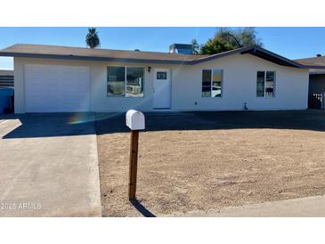 Newly renovated single story home with a clean, modern design and spacious yard at 8323 W Devonshire Ave, Phoenix, AZ 85037