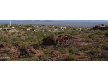 Aerial view of a luxury community nestled in a mountainous region at 15848 E Palomino Blvd, Fountain Hills, AZ 85268