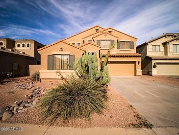 Two-story house with desert landscaping and a two-car garage at 42796 W Oakland Dr, Maricopa, AZ 85138